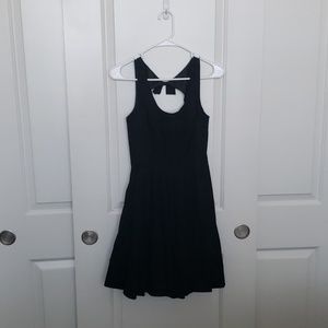 Black dress with back cutout and bow detail